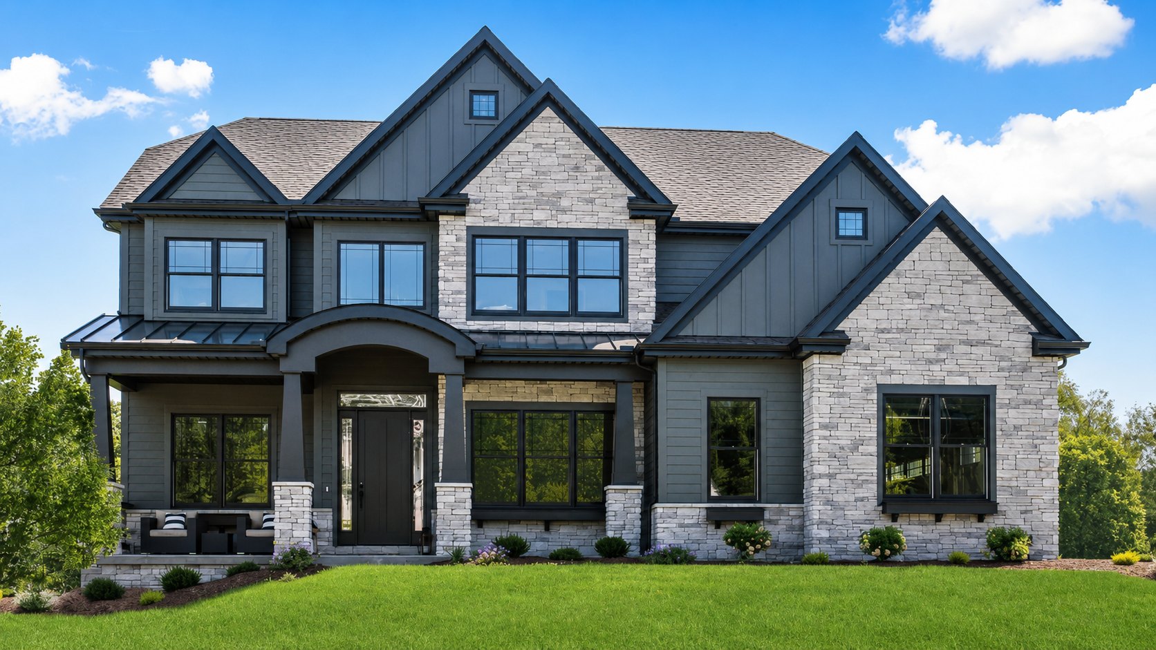 Front elevation of a two-storey home with stone and board-and-batten siding